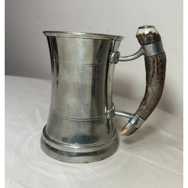 This vintage handmade polished pewter and natural stag horn mug is a unique and charming piece of drinkware. Made with...