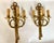 A magnificent pair of antique french bronze wall sconces, exuding timeless elegance and grandeur. these substantial...