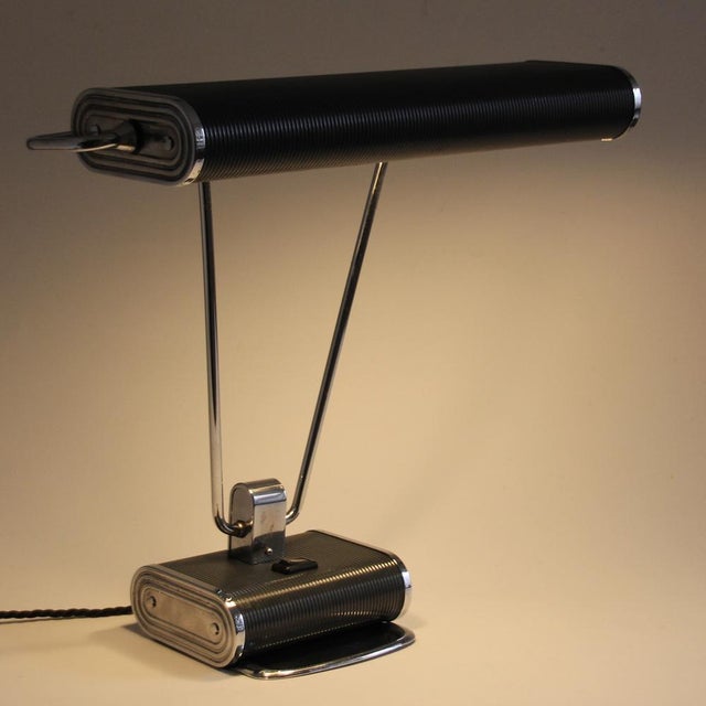 Jumo Model 71! This lamp was designed by Eileen Gray for Jumo in France. Reflector and base are made from corrugated steel...