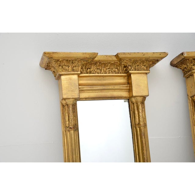 A stunning pair of antique Regency period gilt wood pier mirrors. They were made in England, they date from around the...