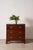 19th-century mahogany chest featuring four graduated drawers, octagonal brass backplate pulls, and bracket feet.