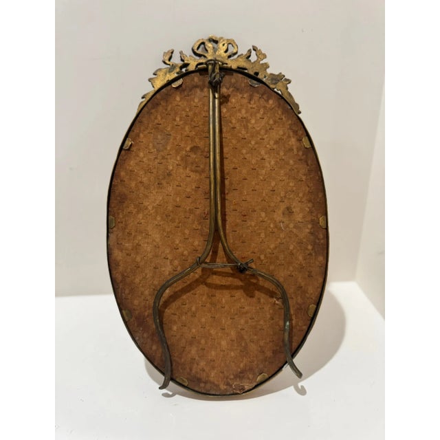 Glass Antique French Gilt Bronze Oval Mirror With Floral Crest For Sale - Image 7 of 8
