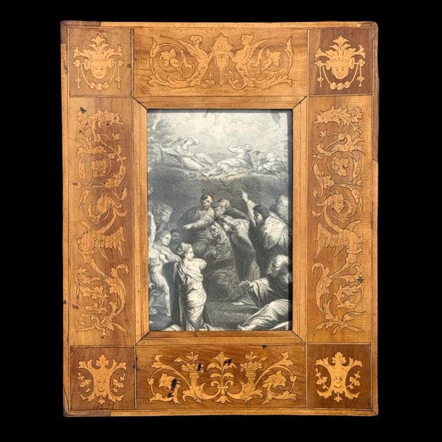 An Italian Sorrento Renaissance Revival marquetry wood picture frame with intricate inlaid wood decoration. Featuring...