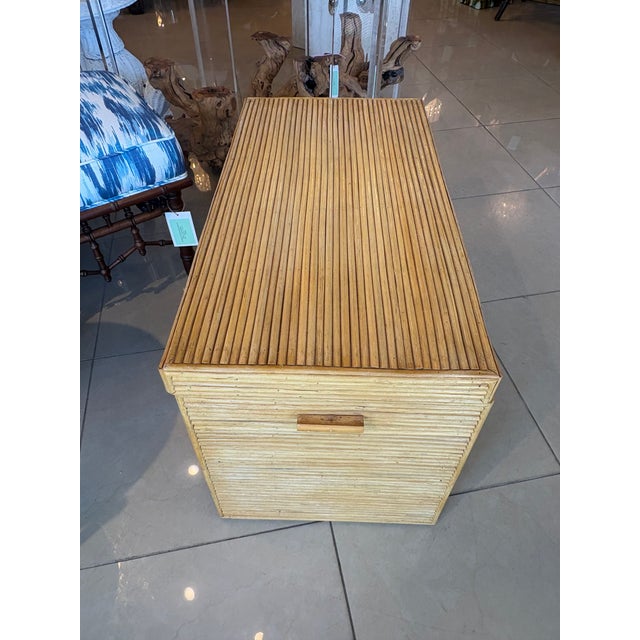 Vintage pencil reed bamboo chest trunk. We installed new brass hardware inside. Original vintage finish with no damage....
