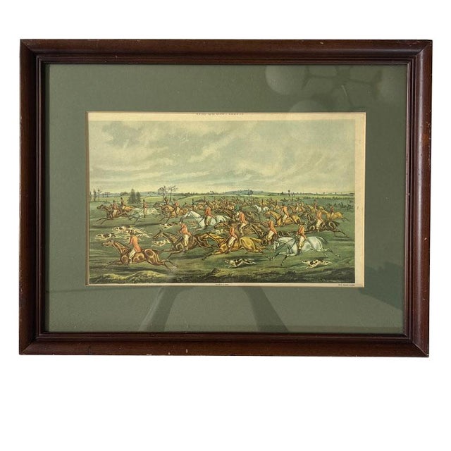 A framed FC Lewis Fox Hunting print. This piece was originally printed in 1835. It features a group of English men in red...