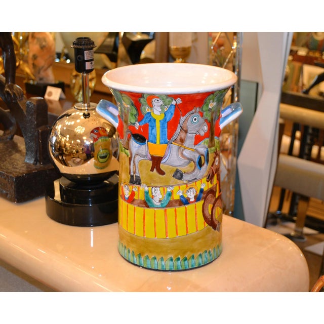 A glazed and colorful Giovanni Desimone hand painted pottery Vase or Vessel, circa 1969 from Italy. The painting depicts...