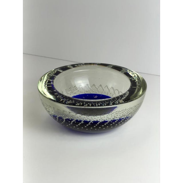 A Murano Sommerso glass bowl by Galliano Ferro, made in Italy during the 1960s, combining deep blue glass with clear...