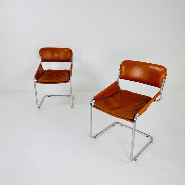 Italian Cognac Leather & Chrome Tubular Sling Chair | 1970s Mid-Century Modern Bring timeless Italian design into your...