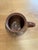 Rich in rustic character, this antique hand-thrown terracotta pot is a timeless decorative accent with enduring appeal....