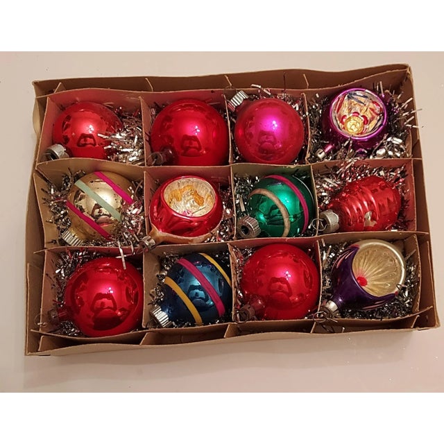 I had a vintage batch of ornaments and picked some of the best to put in this time capsule of a box. The box itself is a...