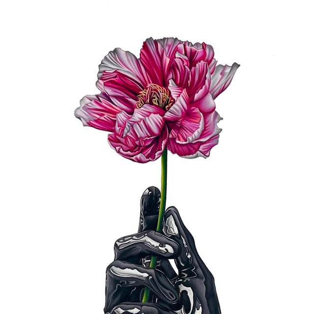 This artwork features a striking contrast between a delicately rendered pink flower and a glossy black hand, which drips...