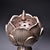 Elegant stemmed incense burner sculpted in the form of a fully bloomed lotus flower. The lotus bloom lid features fine...