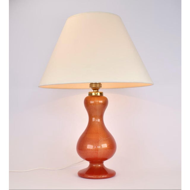 Stunning murano glass table lamp in red with gold flakes. Likely made by the company Barovier & Toso, but not marked. In...