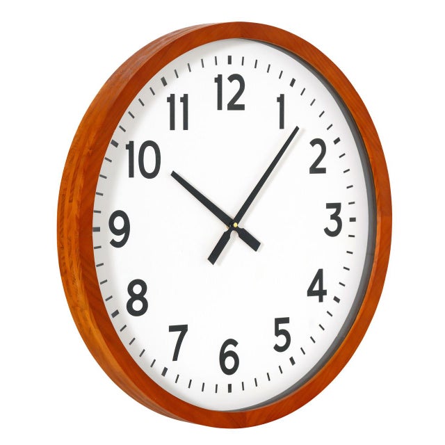 The Warren Wall Clock brings a calm, sun-warmed presence to any room with its wide honey wood frame and clean round 23.5"...