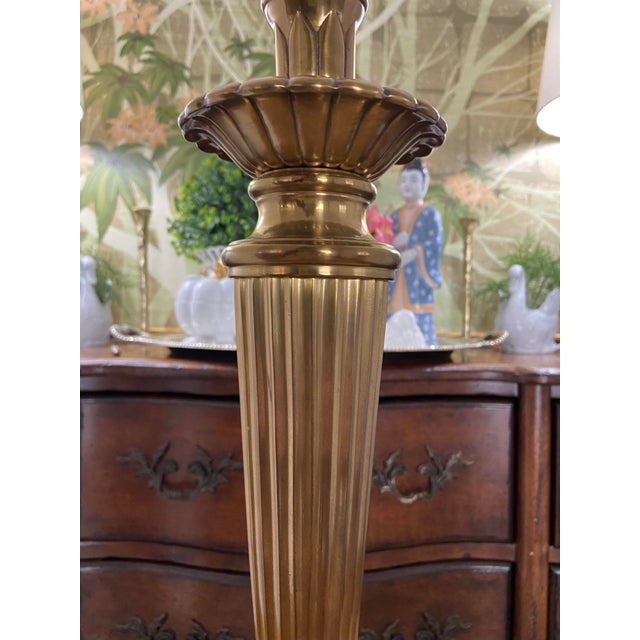 Absolutely lovely vintage antiqued brass tall candlestick lamp with solid black base. This is such a versatile lamp for...