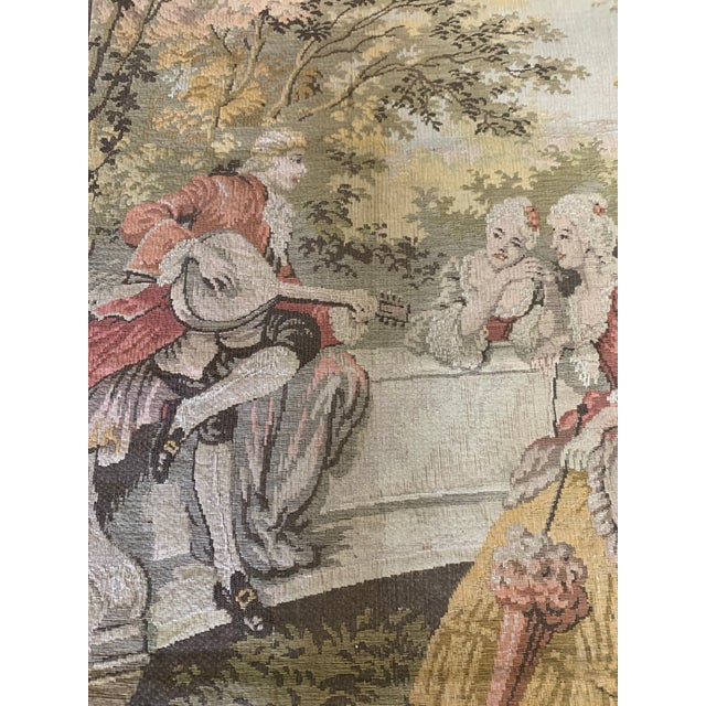 Beautiful antique-to-vintage Belgian woven tapestry featuring an elegant 18th-century romantic courtship scene. The finely...