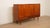 This stunning vintage wall cabinet is a wonderful example of authentic Danish design. The cabinet is finished in high-...
