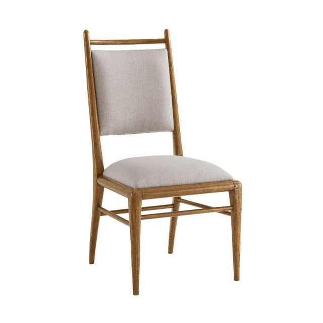 Light oak dining chair in our dawn finish, with a padded back and seat upholstered in performance linen fabric adds...
