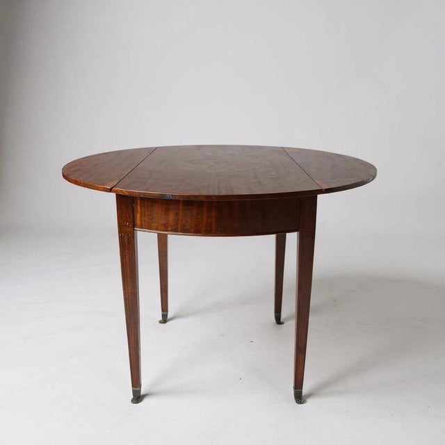 The mahogany drop leaf table is a versatile and elegant piece designed to bring both style and function to your home....