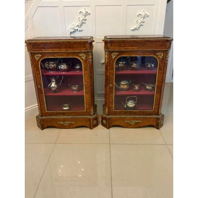 An exceptional pair of Victorian burr walnut pier cabinets of outstanding quality, retaining a rich colour and beautifully...