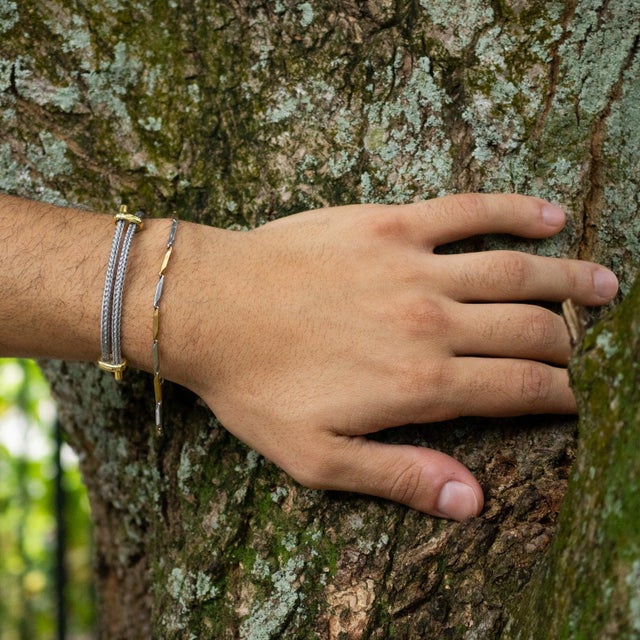 Elevate your everyday style with the Grey Glow Adjustable Gold Rope Bracelet, a minimalist yet sophisticated unisex...