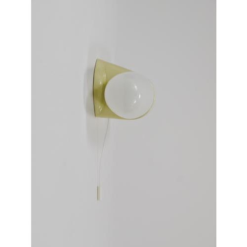 A midcentury modern double socket wall lamp/sconce dating back to the 1950s, designed by wilhelm wagenfeld. Its form...