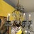 Elegant and curvaceous bronze finish iron chandelier with drop crystal pendants. The crystals swag between the arms and...