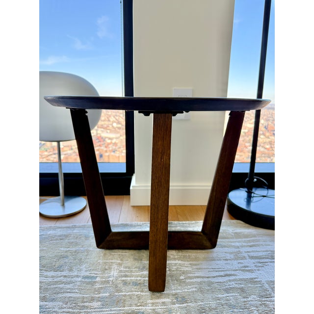 Small, lightweight dark walnut side table with cutout-style, intersecting base Solid mango wood. Made in a Fair Trade...