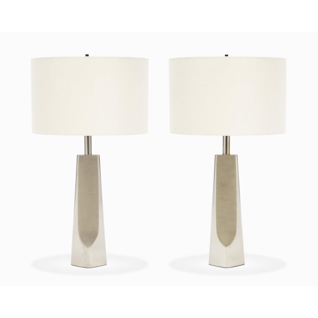 Here is a pair of vintage mid century table lamps by the Laurel Lamp Company. They are a cast metal form with a mix of...