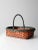 This is a vintage handle basket. The woven basket features a splint weave red body with green braided trim and handle. A...