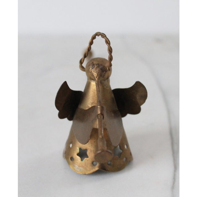 Vintage brass angel candle snuffer. No makers mark. Some patina/age wear.