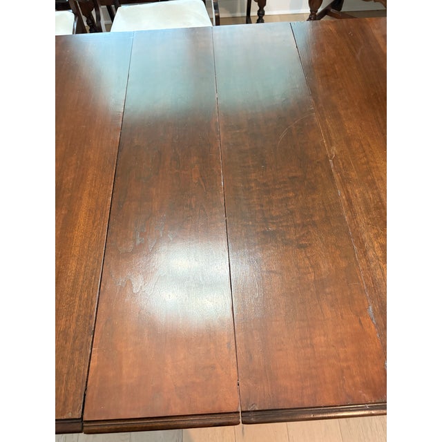 Beautiful, complete antique Jacobean dining room set from the 1920s. Solid, walnut well-crafted pieces with timeless...