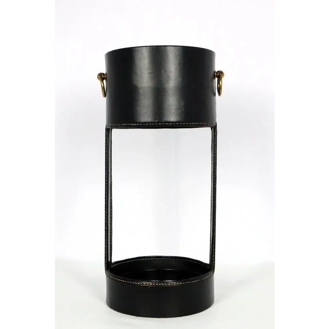 Umbrella stand by Jacques Adnet, Atelier Pinchon AAA 1950. Metal frame covered in black leatherette with saddle stitching....