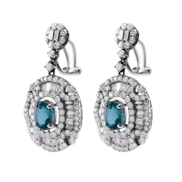 Beautiful natural oval emerald and diamonds drop earrings. 5.68 carats total gemstone weight. 2 oval emeralds, 1.75...