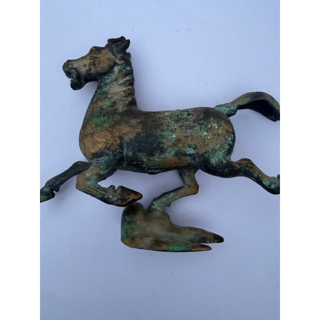 Bring a touch of ancient history and striking texture to your space with this vintage cast metal replica of the iconic...