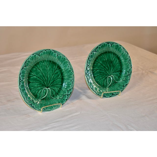 Pair of 19th century signed Wedgwood majolica plates in vibrant green. These plates are in the famous single leaf pattern...