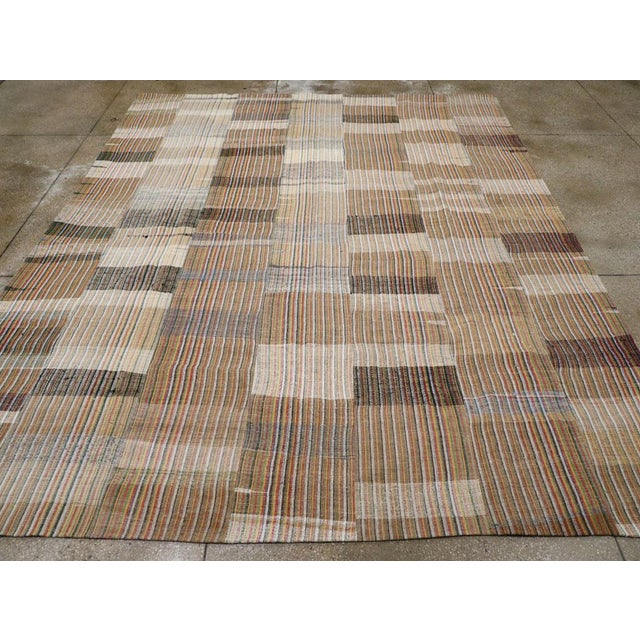 A vintage Turkish flatweave Kilim room size carpet handmade during the mid-20th century. Measures: 10' 7" x 13' 0".