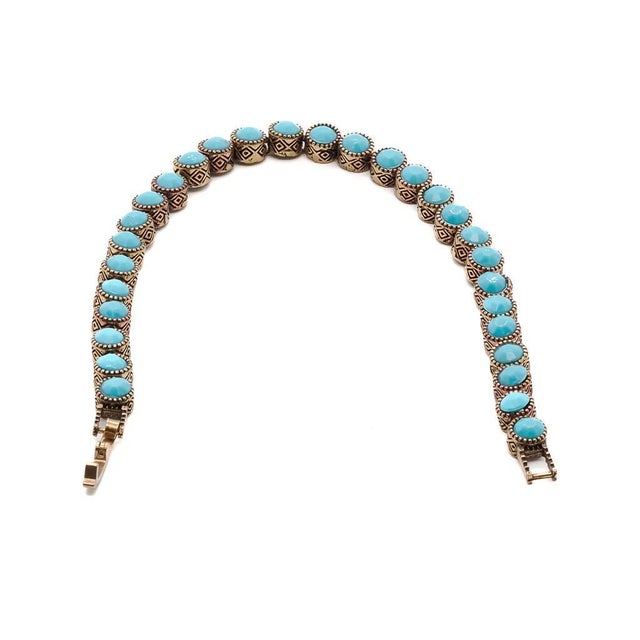 Turquoise Tennis Bracelet is stylish and full of energy. This simple bronze tennis bracelet has turquoise reconstituted...