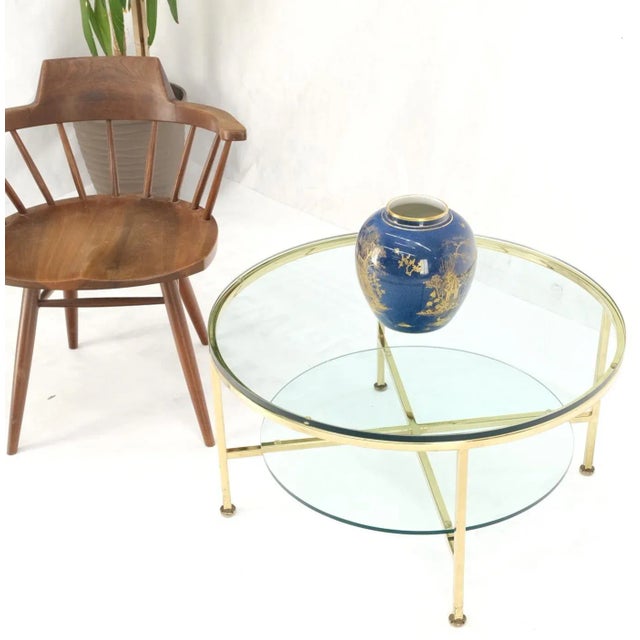 Two tier cross shape brass base round occasional coffee side end table stand. Paul McCobb style - attributed.