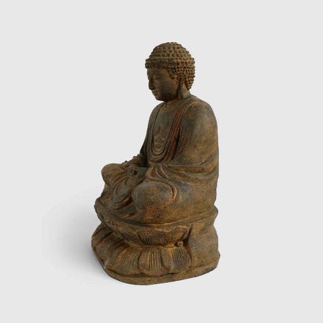 Peaceful cast stone sitting Buddha seated in resting position with beautiful draped robe design. Great focal piece indoors...