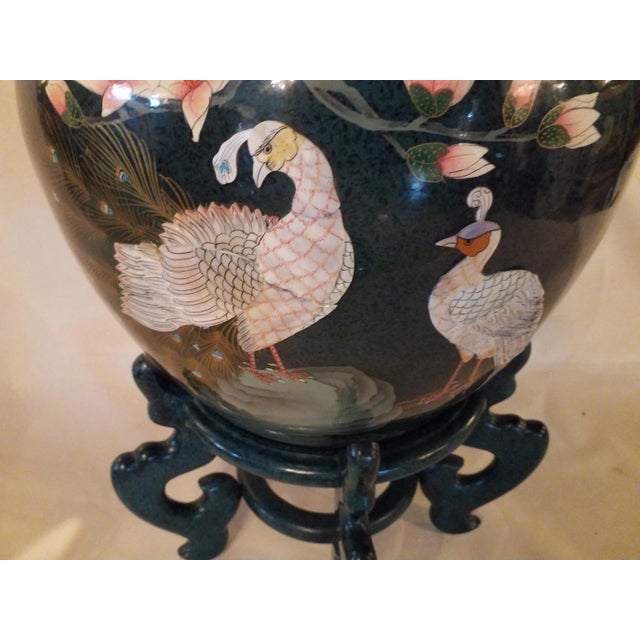 This fabulous planter with matching stand features both male and female pheasants in mothe rof pearl. Can be used as a...