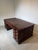 A beautiful antique double-sided executive desk crafted in rich mahogany. This impressive desk is designed to be viewed...