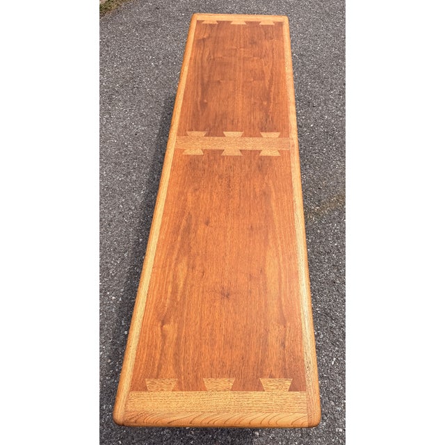 Extra-long vintage mid-century modern Lane Acclaim coffee table designed by Andre Bus features iconic contrasting oak...