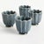 In a classic silhouette with petal edges, these footed mini pots are natureinspired. Finished in a rich teal reactive...