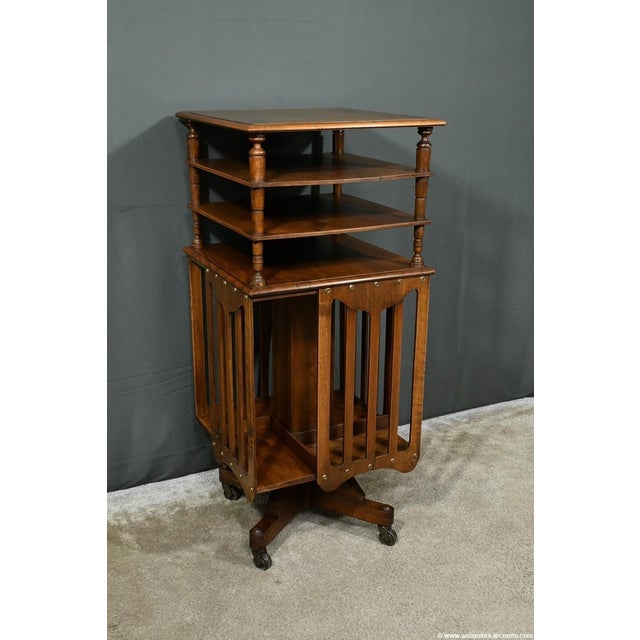 This revolving walnut bookcase, dating from 1900, is an exceptional piece stamped by the manufacturer G. Lancelin,...