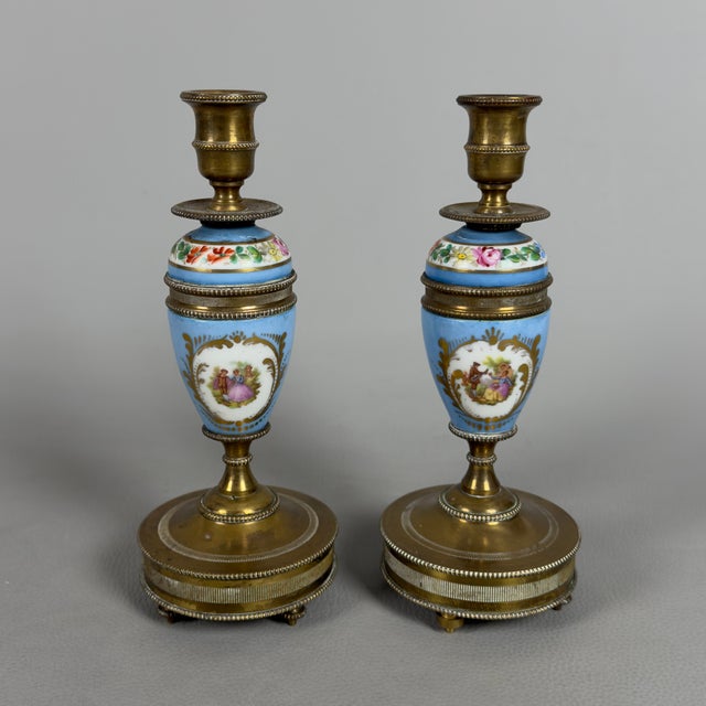 An exceptional and rare pair of exquisite French candlesticks, perfect for adding a touch of romantic elegance and...