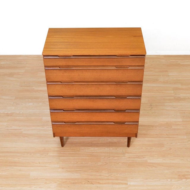 This vintage mid-century console dresser was produced by Avalon Yatton during the 1960s. A vintage teak dresser with six...