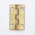 Vintage cabinet door hinge made of polished brass with flat tips, five knuckles, and a template hole pattern. The original...