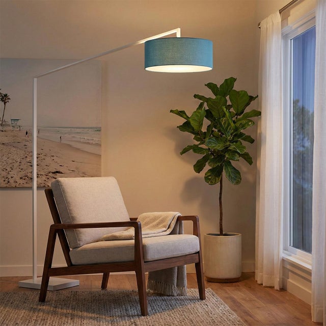 The Stretch Arc Floor Lamp is a modern lighting solution designed by Kirby Groce in 2011. This lamp features a striking...
