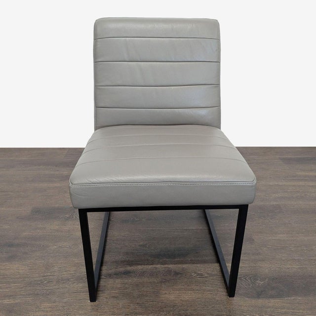 Leather channel tufted chair on metal sled legs. Brand: Crate & Barrel. Original Price: $499. Dimensions (in): 21W x 24D x...